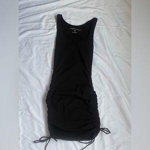Body con black dress with tie detailing on both sides of the dress